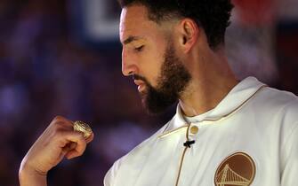 SAN FRANCISCO, CALIFORNIA - OCTOBER 18:  Klay Thompson #11 of the Golden State Warriors inspects his championship ring during a ceremony prior to the game against the Los Angeles Lakers at Chase Center on October 18, 2022 in San Francisco, California. NOTE TO USER: User expressly acknowledges and agrees that, by downloading and or using this photograph, User is consenting to the terms and conditions of the Getty Images License Agreement. (Photo by Ezra Shaw/Getty Images)