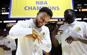 SAN FRANCISCO, CALIFORNIA - OCTOBER 18:  Stephen Curry #30 of the Golden State Warriors inspects his championship ring during a ceremony prior to the game against the Los Angeles Lakers at Chase Center on October 18, 2022 in San Francisco, California. NOTE TO USER: User expressly acknowledges and agrees that, by downloading and or using this photograph, User is consenting to the terms and conditions of the Getty Images License Agreement. (Photo by Ezra Shaw/Getty Images)