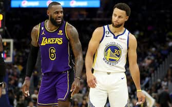 SAN FRANCISCO, CALIFORNIA - OCTOBER 18: LeBron James #6 of the Los Angeles Lakers speaks to Stephen Curry #30 of the Golden State Warriors during their game at Chase Center on October 18, 2022 in San Francisco, California. NOTE TO USER: User expressly acknowledges and agrees that, by downloading and or using this photograph, User is consenting to the terms and conditions of the Getty Images License Agreement. (Photo by Ezra Shaw/Getty Images)