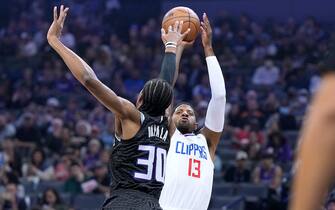 SACRAMENTO, CALIFORNIA - OCTOBER 22: Paul George #13 of the LA Clippers shoots over KZ Okpala #30 of the Sacramento Kings during the first quarter of the game at Golden 1 Center on October 22, 2022 in Sacramento, California. NOTE TO USER: User expressly acknowledges and agrees that, by downloading and or using this photograph, User is consenting to the terms and conditions of the Getty Images License Agreement. (Photo by Thearon W. Henderson/Getty Images)