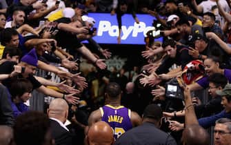 PHOENIX, ARIZONA - NOVEMBER 12: LeBron James #23 of the Los Angeles Lakers walks off the court past fans following the NBA game against the Phoenix Suns at Talking Stick Resort Arena on November 12, 2019 in Phoenix, Arizona. The Lakers defeated the Suns 123-115. NOTE TO USER: User expressly acknowledges and agrees that, by downloading and/or using this photograph, user is consenting to the terms and conditions of the Getty Images License Agreement  (Photo by Christian Petersen/Getty Images)