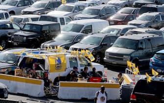 Tailgaters hangout in the parking lot before the Golden State Warriors host the Cleveland Cavaliers in their Game 1 of the NBA Finals at Oracle Arena in Oakland, Calif., on Thursday, June 1, 2017. (Ray Chavez/Bay Area News Group)