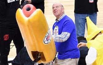 LOS ANGELES, CA - FEBRUARY 28:  Clippers' owner Steve Ballmer shoots hot dogs at the crowd during a basketball game between the Los Angeles Clippers and the Houston Rockets at Staples Center on February 28, 2018 in Los Angeles, California.  (Photo by Allen Berezovsky/Getty Images)