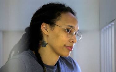 US Women's National Basketball Association (WNBA) basketball player Brittney Griner, who was detained at Moscow's Sheremetyevo airport and later charged with illegal possession of cannabis, waits for the verdict inside a defendants' cage during a hearing in Khimki outside Moscow, on August 4, 2022. - A Russian court found Griner guilty of smuggling and storing narcotics after prosecutors requested a sentence of nine and a half years in jail for the athlete. (Photo by EVGENIA NOVOZHENINA / POOL / AFP) (Photo by EVGENIA NOVOZHENINA/POOL/AFP via Getty Images)