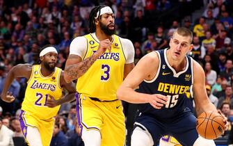 DENVER, CO - OCTOBER 26: Nikola Jokic #15 of the Denver Nuggets drives against Anthony Davis #3 of the Los Angeles Lakers at Ball Arena on October 26, 2022 in Denver, Colorado. (NOTE TO USER: User expressly acknowledges and agrees that, by downloading and/or using this Photograph, user is consenting to the terms and conditions of the Getty Images License Agreement. (Photo by Jamie Schwaberow/Getty Images)