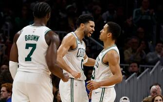 BOSTON, MA - NOVEMBER 4: Jayson Tatum #0 of the Boston Celtics celebrates a basket by Malcolm Brogdon #13, right, during the second half of the game against the Chicago Bulls at TD Garden on November 4, 2022 in Boston, Massachusetts. NOTE TO USER: User expressly acknowledges and agrees that, by downloading and/or using this Photograph, user is consenting to the terms and conditions of the Getty Images License Agreement. (Photo By Winslow Townson/Getty Images)