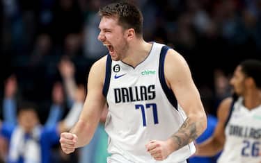 DALLAS, TEXAS - NOVEMBER 15: Luka Doncic #77 of the Dallas Mavericks celebrates after Spencer Dinwiddie #26 of the Dallas Mavericks hits a three-point shot against the LA Clippers in the fourth quarter at American Airlines Center on November 15, 2022 in Dallas, Texas. NOTE TO USER: User expressly acknowledges and agrees that, by downloading and or using this photograph, User is consenting to the terms and conditions of the Getty Images License Agreement. (Photo by Tom Pennington/Getty Images)