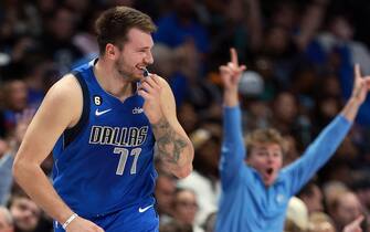 DALLAS, TEXAS - NOVEMBER 18: Luka Doncic #77 of the Dallas Mavericks reacts after scoring against the Denver Nuggets in the third quarter at American Airlines Center on November 18, 2022 in Dallas, Texas. User expressly acknowledges and agrees that, by downloading and or using this photograph, User is consenting to the terms and conditions of the Getty Images License Agreement. (Photo by Tom Pennington/Getty Images)