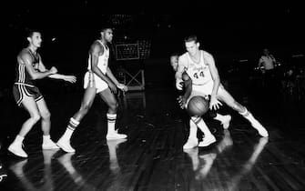 Basketball... Los Angeles Lakers versus St. Louis Hawks, 12 December 1960. Rudy La Russo;Jerry West;Rod Hundley;Elgin Baylor. (Sleeve reads: SP-12950).;Caption slip reads: 'Photographer: Jensen. Date: 1960-12-12. Assignment: L.A vs Hawks. Photographer: Jensen. 102: Selvy. 103: La Russo being fouled. 15: 34 H;35 LA 16: West being fouled by 17 H. 19: Hundley scores. 20: Baylor scores. 21: 34 H fouls West #44'.;Supplementary material reads: '1960-1961 St. Louis Hawks player roster: No. 11: Ferrari, Al...;No. 14: Foust, Larry...;No. 17: Green, Sihugo...;No. 16: Hagan, Cliff...;No. 19: La Cour, Fred...;No. 34: Lovellette, Clyde...;No. 15: McCarthy, John...;No. 9: Pettit, Bob...;No. 25: Piontek, Dave...;No. 21: Sauldsberry, W...;No. 32: Wilkins, Len...;Coach: Paul Seymour'.. (Photo by Los Angeles Examiner/USC Libraries/Corbis via Getty Images)