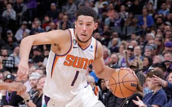 SACRAMENTO, CA - NOVEMBER 28: Devin Booker #1 of the Phoenix Suns drives to the basket during the game against the Sacramento Kings on November 28, 2022 at Golden 1 Center in Sacramento, California. NOTE TO USER: User expressly acknowledges and agrees that, by downloading and or using this Photograph, user is consenting to the terms and conditions of the Getty Images License Agreement. Mandatory Copyright Notice: Copyright 2022 NBAE (Photo by Rocky Widner/NBAE via Getty Images)