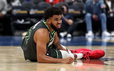 WASHINGTON, DC - NOVEMBER 28: Karl-Anthony Towns #32 of the Minnesota Timberwolves reacts after being injured in the third quarter against the Washington Wizards at Capital One Arena on November 28, 2022 in Washington, DC. NOTE TO USER: User expressly acknowledges and agrees that, by downloading and or using this photograph, User is consenting to the terms and conditions of the Getty Images License Agreement. (Photo by Rob Carr/Getty Images)