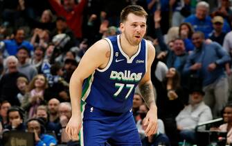 DALLAS, TEXAS - DECEMBER 27:  Luka Doncic #77 of the Dallas Mavericks reacts after scoring the game tying basket against the New York Knicks in the second half at American Airlines Center on December 27, 2022 in Dallas, Texas. NOTE TO USER: User expressly acknowledges and agrees that, by downloading and or using this photograph, User is consenting to the terms and conditions of the Getty Images License Agreement.  (Photo by Tim Heitman/Getty Images)