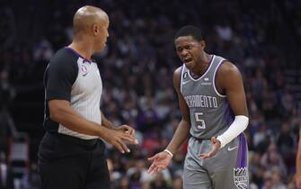 SACRAMENTO, CALIFORNIA - NOVEMBER 20: De'Aaron Fox #5 of the Sacramento Kings argues with referee Marc Davis #8 in the fourth quarter of the game against the Detroit Pistons at Golden 1 Center on November 20, 2022 in Sacramento, California. NOTE TO USER: User expressly acknowledges and agrees that, by downloading and/or using this photograph, User is consenting to the terms and conditions of the Getty Images License Agreement. (Photo by Lachlan Cunningham/Getty Images)