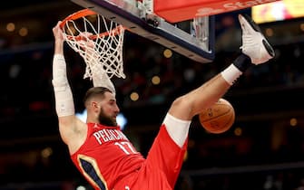 WASHINGTON, DC - JANUARY 09: Jonas Valanciunas #17 of the New Orleans Pelicans dunks in front of Rui Hachimura #8 of the Washington Wizards in the second half at Capital One Arena on January 09, 2023 in Washington, DC.  NOTE TO USER: User expressly acknowledges and agrees that, by downloading and or using this photograph, User is consenting to the terms and conditions of the Getty Images License Agreement. (Photo by Rob Carr/Getty Images)