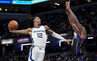 INDIANAPOLIS, INDIANA - JANUARY 14: Ja Morant #12 of the Memphis Grizzlies dunks the ball over Jalen Smith #25 of the Indiana Pacers in the third quarter at Gainbridge Fieldhouse on January 14, 2023 in Indianapolis, Indiana. NOTE TO USER: User expressly acknowledges and agrees that, by downloading and or using this photograph, User is consenting to the terms and conditions of the Getty Images License Agreement. (Photo by Dylan Buell/Getty Images)