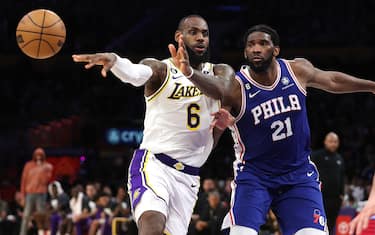 LOS ANGELES, CALIFORNIA - JANUARY 15:  LeBron James #6 of the Los Angeles Lakers passes the ball as Joel Embiid #21 of the Philadelphia 76ers defends during the second half of a game at Crypto.com Arena on January 15, 2023 in Los Angeles, California.  NOTE TO USER: User expressly acknowledges and agrees that, by downloading and or using this photograph, User is consenting to the terms and conditions of the Getty Images License Agreement. (Photo by Sean M. Haffey/Getty Images)