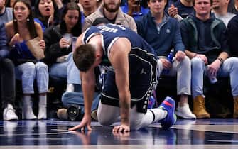 DALLAS, TX - FEBRUARY 2: Luka Doncic #77 of the Dallas Mavericks gets up slowly after landing hard on the court against the New Orleans Pelicans in the second half at American Airlines Center on February 2, 2023 in Dallas, Texas. The Mavericks won 111-106. NOTE TO USER: User expressly acknowledges and agrees that, by downloading and or using this photograph, user is consenting to the terms and conditions of the Getty Images License Agreement. (Photo by Ron Jenkins/Getty Images) 