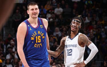 DENVER, CO - MARCH 3: Nikola Jokic #15 of the Denver Nuggets and Ja Morant #12 of the Memphis Grizzlies talk during the game on March 3, 2023 at the Ball Arena in Denver, Colorado. NOTE TO USER: User expressly acknowledges and agrees that, by downloading and/or using this Photograph, user is consenting to the terms and conditions of the Getty Images License Agreement. Mandatory Copyright Notice: Copyright 2023 NBAE (Photo by Nathaniel S. Butler/NBAE via Getty Images)