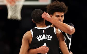 NEW YORK, NEW YORK - MARCH 29:  Cameron Johnson #2 hugs Mikal Bridges #1 of the Brooklyn Nets as the seconds tick off the clock as the Nets defeat the Houston Rockets to win the game at Barclays Center on March 29, 2023 in New York City. (Photo by Jamie Squire/Getty Images)