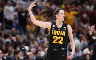 DALLAS, TX - MARCH 31: Caitlin Clark #22 of the Iowa Hawkeyes celebrates making a three-point shot against the South Carolina Gamecocks during the semifinals of the NCAA Women's Basketball Tournament Final Four at American Airlines Center on March 31, 2023 in Dallas, Texas. (Photo by Justin Tafoya/NCAA Photos via Getty Images)