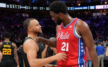 PHILADELPHIA, PA - DECEMBER 11: Joel Embiid #21 of the Philadelphia 76ers and Stephen Curry #30 of the Golden State Warriors talk after a game on December 11, 2021 at Wells Fargo Center in Philadelphia, Pennsylvania. NOTE TO USER: User expressly acknowledges and agrees that, by downloading and/or using this Photograph, user is consenting to the terms and conditions of the Getty Images License Agreement. Mandatory Copyright Notice: Copyright 2021 NBAE (Photo by Jesse D. Garrabrant/NBAE via Getty Images) 
