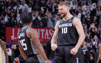 SACRAMENTO, CA - APRIL 17:  Davion Mitchell #15 and Domantas Sabonis #10 of the Sacramento Kings react during the game against the Golden State Warriors during Round 1 Game 2 of the 2023 NBA Playoffs on April 17, 2023 at Golden 1 Center in Sacramento, California. NOTE TO USER: User expressly acknowledges and agrees that, by downloading and or using this Photograph, user is consenting to the terms and conditions of the Getty Images License Agreement. Mandatory Copyright Notice: Copyright 2023 NBAE (Photo by Rocky Widner/NBAE via Getty Images)