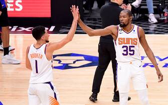 LOS ANGELES, CA - APRIL 22:  Devin Booker #1 of the Phoenix Suns high fives Kevin Durant #35 during the game against the LA Clippers during Round 1 Game 4 of the 2023 NBA Playoffs on April 22, 2023 at Crypto.Com Arena in Los Angeles, California. NOTE TO USER: User expressly acknowledges and agrees that, by downloading and/or using this Photograph, user is consenting to the terms and conditions of the Getty Images License Agreement. Mandatory Copyright Notice: Copyright 2023 NBAE (Photo by Adam Pantozzi/NBAE via Getty Images)