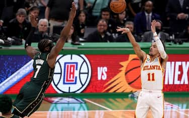 BOSTON, MASSACHUSETTS - APRIL 25: Trae Young #11 of the Atlanta Hawks shoots the game winning 29-foot three point basket against Jaylen Brown #7 of the Boston Celtics during the fourth quarter in game five of the Eastern Conference First Round Playoffs at TD Garden on April 25, 2023 in Boston, Massachusetts. NOTE TO USER: User expressly acknowledges and agrees that, by downloading and or using this photograph, User is consenting to the terms and conditions of the Getty Images License Agreement. (Photo by Maddie Meyer/Getty Images)