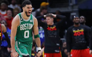 ATLANTA, GEORGIA - APRIL 27:  Jayson Tatum #0 of the Boston Celtics reacts after dunking the ball on a rebound against the Atlanta Hawks during the fourth quarter of Game Six of the Eastern Conference First Round Playoffs at State Farm Arena on April 27, 2023 in Atlanta, Georgia.  NOTE TO USER: User expressly acknowledges and agrees that, by downloading and or using this photograph, User is consenting to the terms and conditions of the Getty Images License Agreement.  (Photo by Kevin C. Cox/Getty Images)