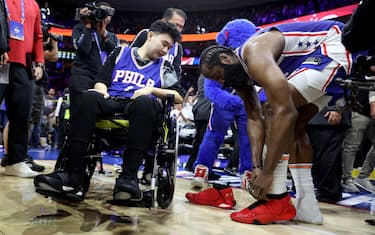 PHILADELPHIA, PENNSYLVANIA - MAY 07: James Harden #1 of the Philadelphia 76ers gives his game sneakers to Michigan State shooting survivor John Hao after defeating the Boston Celtics in game four of the Eastern Conference Second Round Playoffs at Wells Fargo Center on May 07, 2023 in Philadelphia, Pennsylvania. NOTE TO USER: User expressly acknowledges and agrees that, by downloading and or using this photograph, User is consenting to the terms and conditions of the Getty Images License Agreement. (Photo by Tim Nwachukwu/Getty Images)