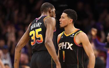 PHOENIX, ARIZONA - MAY 05: Devin Booker #1 of the Phoenix Suns celebrates with Kevin Durant #35 after a three-point shot against the Denver Nuggets during the first half of Game Three of the NBA Western Conference Semifinals at Footprint Center on May 05, 2023 in Phoenix, Arizona.  NOTE TO USER: User expressly acknowledges and agrees that, by downloading and or using this photograph, User is consenting to the terms and conditions of the Getty Images License Agreement.  (Photo by Christian Petersen/Getty Images)