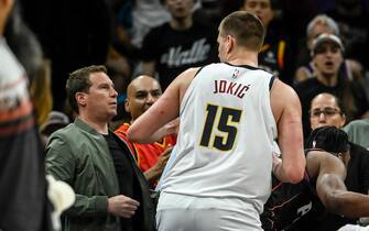 PHOENIX, AZ - MAY 7: Nikola Jokic (15) of the Denver Nuggets slightly stares at Phoenix Suns owner Mat Ishbia before would Ishbia theatrically fall back into his seat  after Suns player Josh Okogie (2) flew into the stands during the second quarter at Footprint Center in Phoenix on Sunday, May 7, 2023. (Photo by AAron Ontiveroz/The Denver Post)
