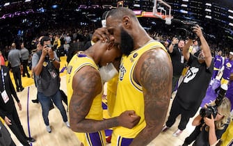 LOS ANGELES, CA - MAY 8: (EDITORS NOTE: Image was taken with a circular fisheye lens.) LeBron James #6 of the Los Angeles Lakers embraces Lonnie Walker IV #4 of the Los Angeles Lakers after the game against the Golden State Warriors during Game 4 of the 2023 NBA Playoffs Western Conference Semi Finals on May 8, 2023 at Crypto.Com Arena in Los Angeles, California. NOTE TO USER: User expressly acknowledges and agrees that, by downloading and/or using this Photograph, user is consenting to the terms and conditions of the Getty Images License Agreement. Mandatory Copyright Notice: Copyright 2023 NBAE (Photo by Andrew D. Bernstein/NBAE via Getty Images) 
