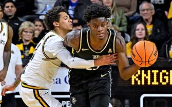 WICHITA, KS - FEBRUARY 08:  Taylor Hendricks #25 of the UCF Knights is fouled by Craig Porter Jr. #3 of the Wichita State Shockers during a game in the second half at Charles Koch Arena on February 8, 2023 in Wichita, Kansas.  (Photo by Peter G. Aiken/Getty Images) *** Local Caption *** Taylor Hendricks;Craig Porter Jr. 
