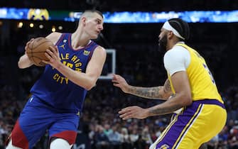 DENVER, COLORADO - MAY 16: Nikola Jokic #15 of the Denver Nuggets looks to pass the ball against Anthony Davis #3 of the Los Angeles Lakers during the third quarter in game one of the Western Conference Finals at Ball Arena on May 16, 2023 in Denver, Colorado. NOTE TO USER: User expressly acknowledges and agrees that, by downloading and or using this photograph, User is consenting to the terms and conditions of the Getty Images License Agreement. (Photo by Matthew Stockman/Getty Images)