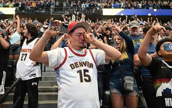 DENVER, COLORADO - MAY 22: Denver native Zeke Deleon, 38, gets emotional as he watches the Denver Nuggets win Game 4 of the Western Conference Finals on the big screen at Ball Arena on May 22, 2023 in Denver, Colorado. The Denver Nuggets were playing Los Angeles Lakers in Los Angeles when they clinch a spot in the NBA Finals for the first time in franchise history. (Photo by  RJ Sangosti/MediaNews Group/The Denver Post via Getty Images)