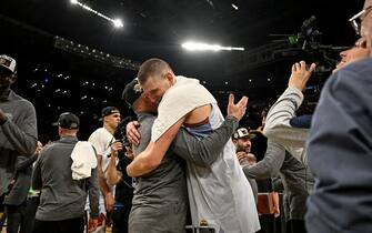 LOS ANGELES, CA - MAY 22: Nikola Jokic (15) of the Denver Nuggets hugs Jason Miller, associate head athletic trainer, after the fourth quarter of the Nuggets' 113-111 Western Conference finals game 4 win over the Los Angeles Lakers at Crypto.com Arena in Los Angeles on Monday, May 22, 2023. The Nuggets swept the best-of-seven series 4-0 to advance to their first NBA Finals in franchise history. (Photo by AAron Ontiveroz/The Denver Post)