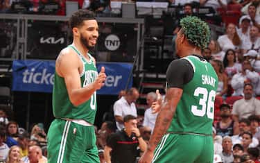 MIAMI, FL - MAY 19:  Jayson Tatum #0 & Marcus Smart #36 of the Boston Celtics high five during the game  during round 3 game 4 of the Eastern Conference Finals 2023 NBA Playoffs on May 19, 2023 at the Kaseya Center Arena in Miami, Florida. NOTE TO USER: User expressly acknowledges and agrees that, by downloading and or using this Photograph, user is consenting to the terms and conditions of the Getty Images License Agreement. Mandatory Copyright Notice: Copyright 2023 NBAE (Photo by Issac Baldizon/NBAE via Getty Images)