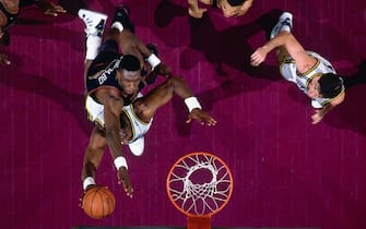 SALT LAKE CITY, UT - MAY 10:  Karl Malone #32 of the Utah Jazz goes up for a shot against Dikembe Mutombo #55 of the Denver Nuggets during Game One of the 1994 Western Conference Semifinals played on May 10 at the Delta Center in Salt Lake City, Utah. Utah defeated Denver 100-91 and won the series 4-3. NOTE TO USER: User expressly acknowledges that, by downloading and or using this photograph, User is consenting to the terms and conditions of the Getty Images License agreement. Mandatory Copyright Notice: Copyright 1994 NBAE (Photo by Andrew D. Bernstein/NBAE via Getty Images)