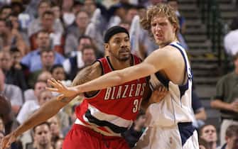 DALLAS - MAY 4:  Rasheed Wallace #30 of the Portland Trail Blazers defends against Dirk Nowitzki #41 of the Dallas Mavericks during Game 7 of the first round of the 2003 NBA Playoffs on May 4, 2003 at the American Airlines Center in Dallas, Texas.  NOTE TO USER:  User expressly acknowledges and agrees that, by downloading and or using this photograph, User is consenting to the terms and conditions of the Getty Images License Agreement.   (Photo by Glenn James/NBAE via Getty Images)