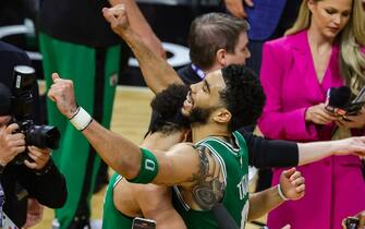 MIAMI, FLORIDA - MAY 27: Jayson Tatum #0 of the Boston Celtics and Derrick White #9 react to defeating the Miami Heat 104-103 in game six of the Eastern Conference Finals at Kaseya Center on May 27, 2023 in Miami, Florida. NOTE TO USER: User expressly acknowledges and agrees that, by downloading and or using this photograph, User is consenting to the terms and conditions of the Getty Images License Agreement. (Photo by Megan Briggs/Getty Images)