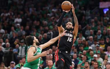 BOSTON, MASSACHUSETTS - MAY 29: Caleb Martin #16 of the Miami Heat attempts a three point basket against Derrick White #9 of the Boston Celtics during the third quarter in game seven of the Eastern Conference Finals at TD Garden on May 29, 2023 in Boston, Massachusetts. NOTE TO USER: User expressly acknowledges and agrees that, by downloading and or using this photograph, User is consenting to the terms and conditions of the Getty Images License Agreement. (Photo by Maddie Meyer/Getty Images)