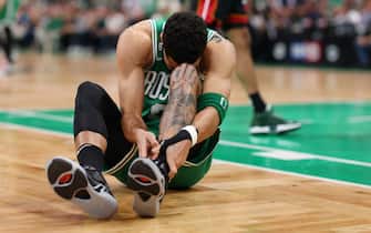 BOSTON, MASSACHUSETTS - MAY 29: Jayson Tatum #0 of the Boston Celtics grabs his ankle during the first quarter against the Miami Heat in game seven of the Eastern Conference Finals at TD Garden on May 29, 2023 in Boston, Massachusetts. NOTE TO USER: User expressly acknowledges and agrees that, by downloading and or using this photograph, User is consenting to the terms and conditions of the Getty Images License Agreement. (Photo by Maddie Meyer/Getty Images)