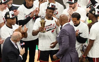 BOSTON, MASSACHUSETTS - MAY 29: Alonzo Mourning presents Jimmy Butler #22 of the Miami Heat with the Larry Bird Trophy after Butler was named the Eastern Conference Finals MVP after defeating the Boston Celtics 103-84 in game seven of the Eastern Conference Finals at TD Garden on May 29, 2023 in Boston, Massachusetts. NOTE TO USER: User expressly acknowledges and agrees that, by downloading and or using this photograph, User is consenting to the terms and conditions of the Getty Images License Agreement. (Photo by Adam Glanzman/Getty Images)