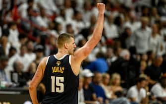 MIAMI, FL - JUNE 9: Nikola Jokic (15) of the Denver Nuggets raises a celebratory fist after a big make by Bruce Brown (11) against the Miami Heat in the fourth quarter of the Nuggets' 108-95 win during Game 4 of the NBA Finals at the Kaseya Center in Miami on Friday, June 9, 2023. (Photo by AAron Ontiveroz/The Denver Post)