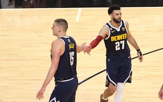 MIAMI, FL - JUNE 9: Nikola Jokic #15 and Jamal Murray #27 of the Denver Nuggets high five during the game against the Miami Heat during Game Four of the 2023 NBA Finals on June 9, 2023 at Kaseya Center in Miami, Florida. NOTE TO USER: User expressly acknowledges and agrees that, by downloading and or using this Photograph, user is consenting to the terms and conditions of the Getty Images License Agreement. Mandatory Copyright Notice: Copyright 2023 NBAE (Photo by Joe Murphy/NBAE via Getty Images)