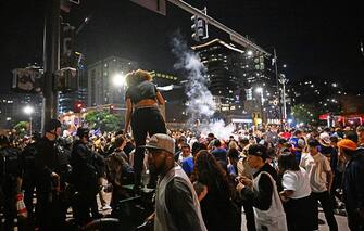 DENVER, COLORADO - JUNE 12: A firework goes off in a crowd of Denver Nugget fans as they celebrate a win over the Miami Heat during Game 5 of the NBA Finals on June 12, 2023 in Denver, Colorado. (Photo by RJ Sangosti/MediaNews Group/The Denver Post via Getty Images)