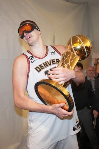 DENVER, CO - JUNE 12: Nikola Jokic #15 of the Denver Nuggets holds the Larry O'Brien trophy after winning Game Five of the 2023 NBA Finals on June 12, 2023 at Ball Arena in Denver, Colorado. NOTE TO USER: User expressly acknowledges and agrees that, by downloading and or using this Photograph, user is consenting to the terms and conditions of the Getty Images License Agreement. Mandatory Copyright Notice: Copyright 2023 NBAE (Photo by Jesse D. Garrabrant/NBAE via Getty Images)