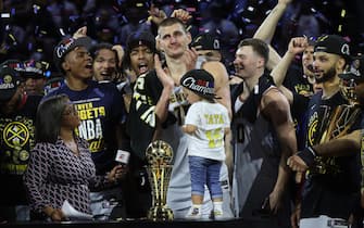 DENVER, COLORADO - JUNE 12: Nikola Jokic #15 of the Denver Nuggets is presented the Bill Russell NBA Finals Most Valuable Player Award after a 94-89 victory against the Miami Heat in Game Five of the 2023 NBA Finals to win the NBA Championship at Ball Arena on June 12, 2023 in Denver, Colorado. NOTE TO USER: User expressly acknowledges and agrees that, by downloading and or using this photograph, User is consenting to the terms and conditions of the Getty Images License Agreement. (Photo by Matthew Stockman/Getty Images)
