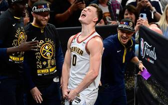 DENVER, CO - JUNE 12: Christian Braun (0) of the Denver Nuggets celebrates on stage after winning the NBA championship against the Miami Heat at Ball Arena June 12, 2023. (Photo by Andy Cross/The Denver Post)
